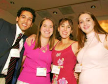 Photo of four scholars taken at the Scholar Awards Dinner in 2004