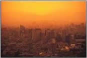 city skyline with a orange sunset haze