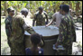 photo thumbnail: LT Nazmul Hassan inspects an uncovered well.