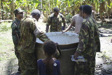 LT Nazmul Hassan inspects an uncovered well.