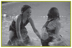 Young girls playing in a swimming pool