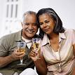 Elderly couple holding wine glasses