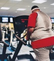 Obese man walking on treadmill
