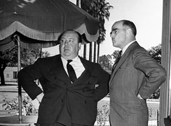 Film director Alfred Hitchcock and Wilder contemplate an exterior shot for Shadow of a Doubt, for which Wilder wrote the screenplay; —Photo by J. R. Eyerman//Time Life Pictures/Getty Images 