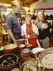 photo of Tater Knob Pottery and Farm owners Sarah Culbreth and Jeff Enge, with their son, David