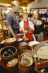 photo of Tater Knob Pottery owners Sarah Culbreth and Jeff Enge with their son, David.