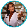 Pharmacist reading label on bottle