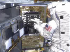 Artist depiction of an astronaut working on Hubble