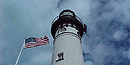 The light tower and flagpole of the Au Sable Light Station stand proudly.