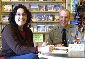 Nancy Dwyer, Falling Rock Cafe, is shown with Superintendent Jim Northup as her business becomes a Community Partner.