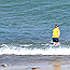 This visitor enjoys wading along the Lake Superior beach, but needs to be wary of rip currents.