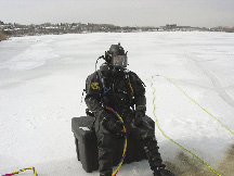 Photo of FBI USERT diver preparing to dive into icy water