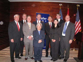 November 19, 2008 – U.S. Secretary of Health and Human Services (HHS) Michael O. Leavitt and the Honorable  Andrew von Eschenbach, M.D., the Commissioner of the HHS Food and Drug Administration (FDA), with the HHS/FDA China team.  From left to right: Commissioner von Eschenbach; Dennis Doupnik, HHS/FDA Consumer-Safety Officer assigned to the U.S. Consulate  General in Shanghai; Dennis Hudson, HHS/FDA Consumer-Safety Officer assigned to the U.S. Consulate General in Shanghai; Secretary  Leavitt; B.J. Marciante, HHS/FDA Consumer-Safety Officer assigned to the U.S. Consulate General in Guangzhou; Charles Ahn,  HHS/FDA Consumer-Safety Officer assigned to the U.S. Consulate General in Guangzhou; Irene Chan, Assistant Country Director  for HHS/FDA in China, assigned to the U.S. Embassy in Beijing; Christopher Hickey, Ph.D., Country Director for HHS/FDA in  China, assigned to the U.S. Embassy in Beijing; Mike Kravchuk, Assistant Country Director for HHS/FDA in China, assigned to  the U.S. Embassy in Beijing. (Photo Credit: Allyson Bell, HHS)