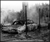 Photograph of burned out car