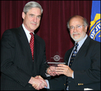 Director Robert S. Mueller, III and Mohammed Moinuddin, Former President of the Muslim Society of Memphis