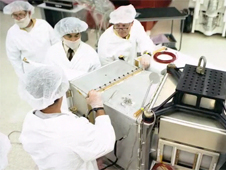 Technicians work on Landsat 5 in the early 1980s.