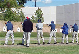 Agents firing at targets from a standing position