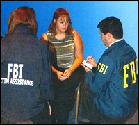 FBI agent and victim assistance specialist conduct an interview