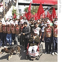 Maoist supporters participate in a street march in Katmandu, Nepal, 06 May 2009