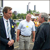Photograph: Minneapolis ASAC Tim Gossfeld meets with President Bush near the bridge site on August 4
