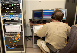 Photgraph of audio technician working on voice identification