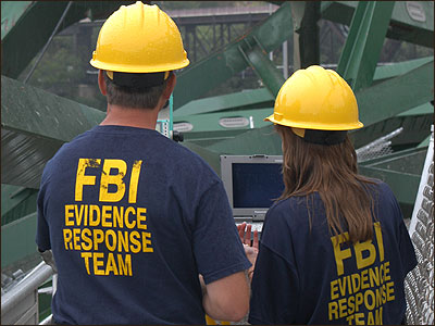 FBI Evidence Response Team members plot wreckage of the I-35W bridge that collapsed August 1 in Minneapolis