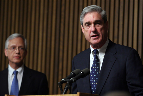 Director Mueller and NCMEC's Earnie Allen address reporters during a press conference