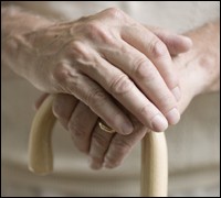 Photograph of Elderly woman's hands holding a cane
