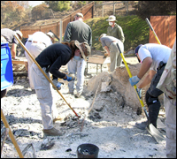 FBI evidence experts at a home destroyed by fire