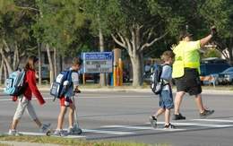 Students head to class Monday at Hans Christian Andersen Elementary in Rockledge. That school remained open Monday despite a confirmed case of swine flu in a student Craig Bailey, FLORIDA TODAY