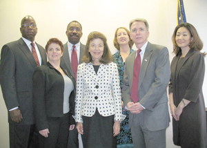 LSC President Helaine M. Barnett (front row, second from left) stands beside Kevin M. Brown, Chief Operating Officer of the American Red Cross. Joining them (from left) are LSC staff Arthur Ford, Mattie Cohan, and Willie Abrams, and Red Cross staff Mary DeWitt-Dia and Juliet K. Choi.
