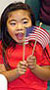 Young girl with American flag.