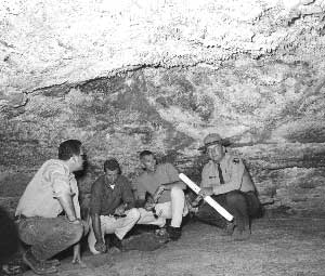 astronauts and park ranger inside lava cave