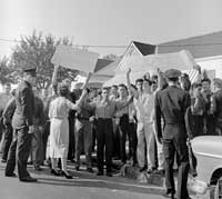 Police in front of demonstrators (Bettmann/CORBIS)