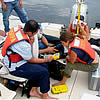 Photo of interns checking GPS equipment.