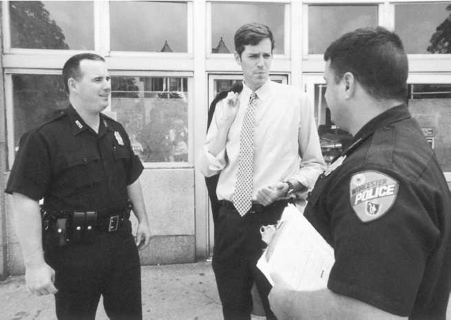 Photograph of police officers talking to a man