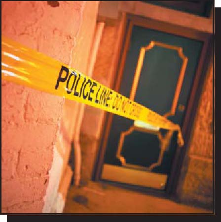 Photograph of police crime scene tape around a crime scene