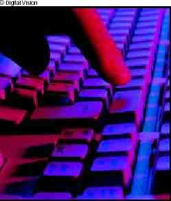 Photograph of finger typing on a computer keyboard