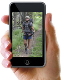 A hand holding an iPod displaying a Shenandoah hiking image