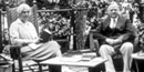 A old picture of the Hoovers sitting on the porch of thier cabin at Rapidan Camp, in Shenandoah National Park.