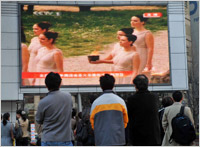 People in China watch a live broadcast from Greece