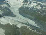 South view of the thinning and retreating terminus of an unnamed valley glacier, west of Wortmanns Glacier. The valley glacier and all of the glaciers shown display evidence of recent thinning and retreat. All are located west of the Tasnuna River and east of the Lowe River, northcentral Chugach Mountains, Alaska. Photograph by Bruce F. Molnia, USGS.