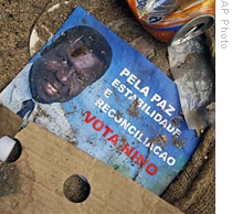 A 2005 campaign poster lies amid trash at the home of assassinated Pres. Vieira in Bissau, 05 Mar 2009