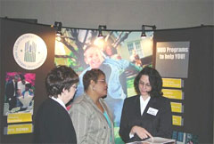Conference participants visit the HUD display for information on HUD Programs.