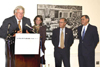 U.S. Housing and Urban Development Secretary Mel Martinez with( L-R ) Susan Dixon and her family, Chairman Bob Ney, Speaker Dennis Hastert, Representative Katherine Harris, Chairman Michael Oxley and Sec Martinez celebrate the House passage of the American Dream Downpayment Initiative legislation (H.R. 1276). 