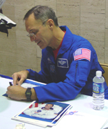 Astronaut Carl Walz signing autographs