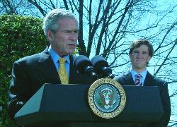 President George W. Bush and  Council member Eli Manning