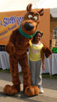 Photo of Scooby Snacks mascot, Scooby-Doo, with a young fan