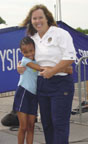 Photo of PCPFS Vice Chair, Dr. Dot Richardson, with a young fan