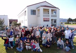 A photo of dozens of park users standing in front of Crissy Field Center.